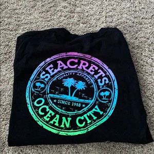 a black seacrets ocean city t shirt